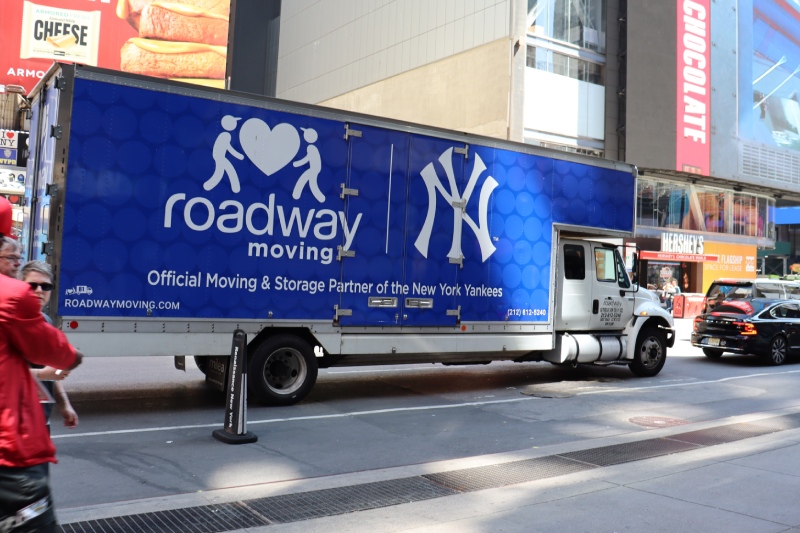 Roadway Moving's truck driving through Manhattan during a move